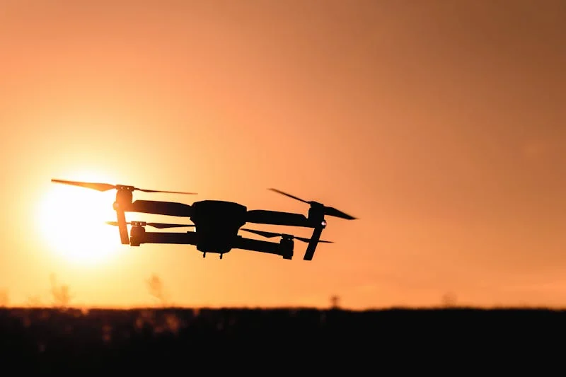 Cleaning drone in flight over solar panels